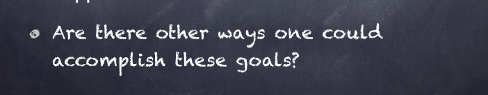A chalkboard with handwritten text asking if there are other ways to accomplish the goals.